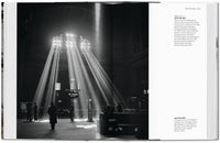 Open book showing a black and white photograph of Union Station in Chicago with light beams and people around, on a white background.