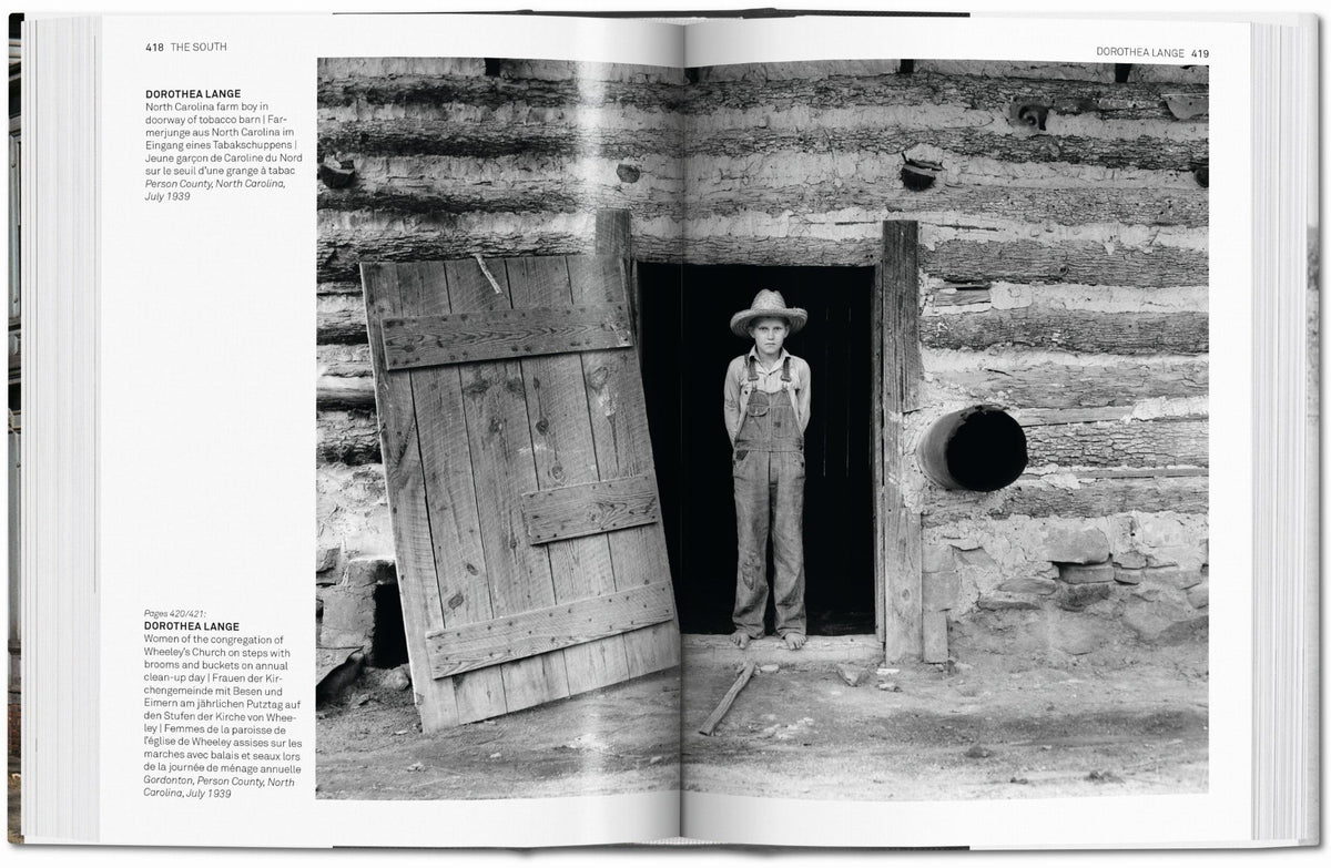Open book showing a black and white photograph of a boy in overalls standing in a log cabin.